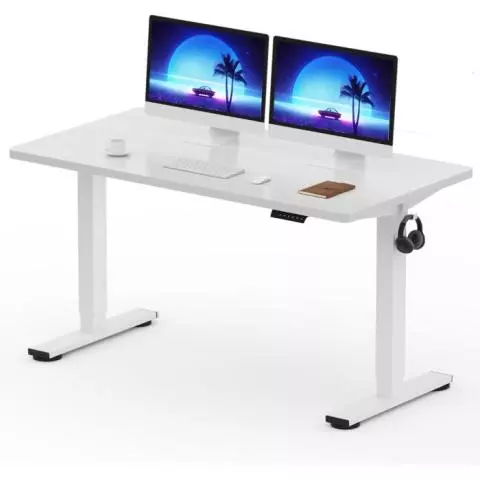 White electric standing desk with dual monitors and headphone hook