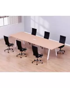 Oak conference table with white angled legs and six black chairs in meeting room