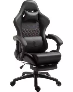 Black and red gaming chair with lumbar pillow and footrest