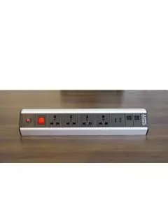 Ergo 14 Desktop Power Module in silver with four universal sockets two USB ports red switch and LED indicator placed on a wooden desk