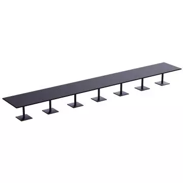 long row of black square pedestal tables arranged in a line