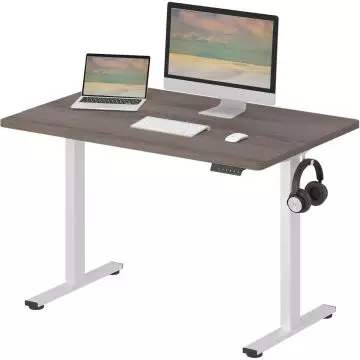 Adjustable standing desk with white metal legs  a dark wood top  equipped with a monitor  laptop  keyboard  mouse  and headphones on a hook.