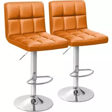 pair of orange PU leather bar stools with chrome pedestal bases
