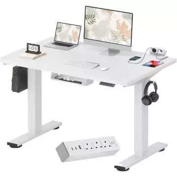 White sit stand desk with built in power strip and cable tray
