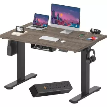 Electric standing desk with gray woodgrain top black frame cable tray and clamp power strip