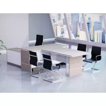 Mahmayi light concrete and white L-shaped executive desk styled in a modern high-rise office setting with black visitor chairs