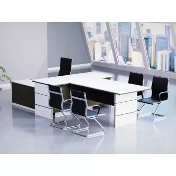 Mahmayi Premium White Lava Grey L-shaped executive desk styled in a modern high-rise office setting with black visitor chairs