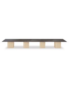 Large rectangular conference table with a dark wood top and light wood square legs  featuring built-in cable management slots.