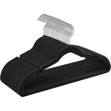 Stack of black velvet hangers with metal hooks