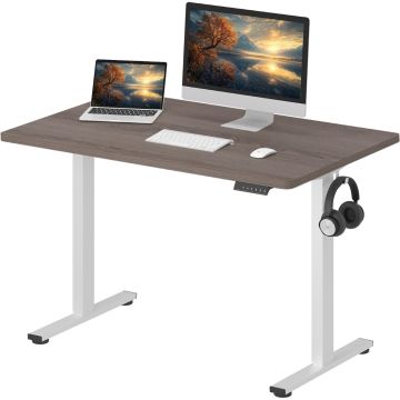 Adjustable standing desk with a dark wood top  white metal legs  and a headphone hook  featuring a computer monitor  laptop  keyboard  and mouse.