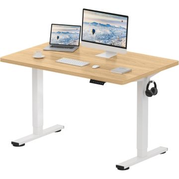 Adjustable standing desk with a wood top and white legs  featuring a laptop  monitor  keyboard  mouse  book  coffee cup  and hanging headphones.