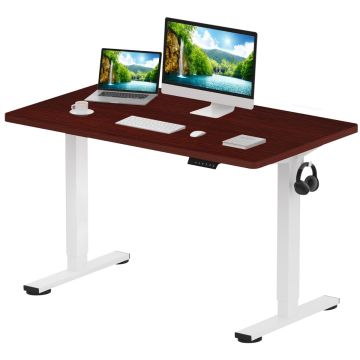 Adjustable height desk with white legs and a dark wood top  featuring a monitor  laptop  keyboard  mouse  book  coffee cup  and headphones.
