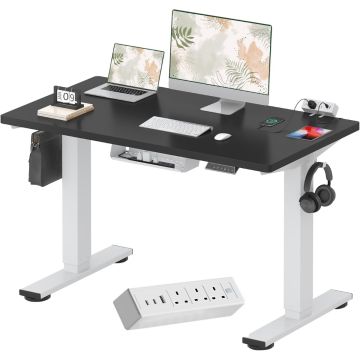 black top white frame electric standing desk with mounted power strip