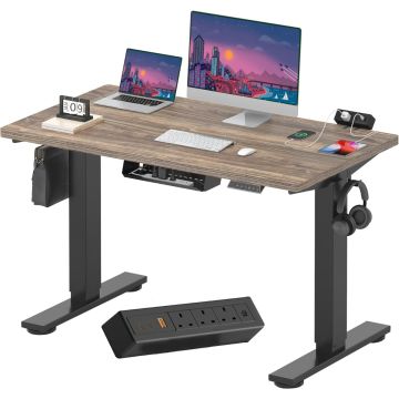 Black walnut electric standing desk with black frame and clamp power strip