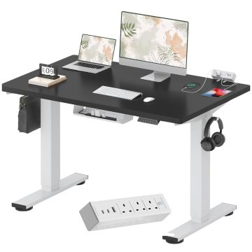 Black top white frame electric standing desk with power strip