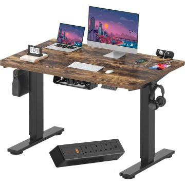 Electric standing desk with rustic brown top black frame and tabletop power strip