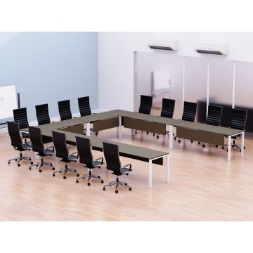 U shaped brown conference table with white metal legs arranged for twelve in a meeting room