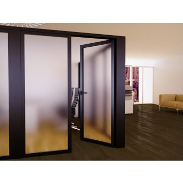 Black aluminum framed frosted glass swing door open in a modern office partition wall