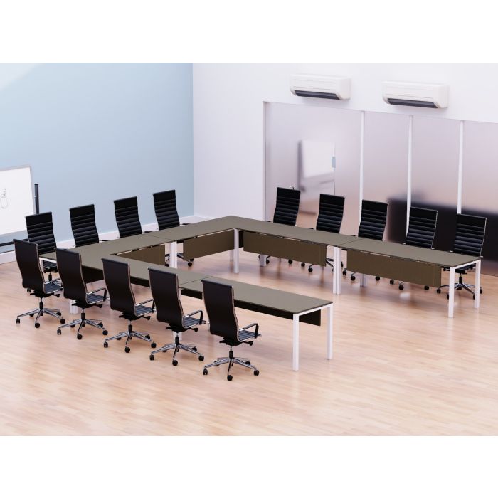 U shaped brown conference table with white metal legs arranged for twelve in a meeting room